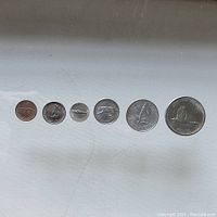 Front side of six Canadian 1967 centennial coins showing commemorative animal designs