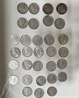 Overview of all 31 Canadian silver dimes arranged in rows on a white background, showing the obverse with the iconic Bluenose schooner design.