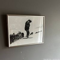 Front view of framed photograph hung on wall