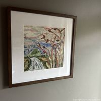 Framed oil painting on paper showing Ashbridges Bay landscape with tree branches and waterway, hung on wall.