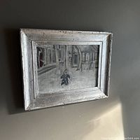 Full view of the framed oil painting showing the winter street scene with a child in the snow.