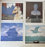 Four Rene Magritte prints laid out together showing surreal imagery including horse head, silhouette man, ship, and bird in sky.