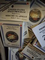 Close-up of limited edition numbered set header card and individual sealed trading card featuring Apollo 13 mission patch.