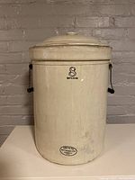 Front view of the large antique crock pot with lid, showing the '8 Imperial' mark and Medalta Pottery stamp.