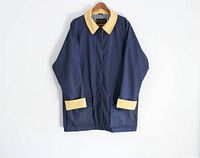 Full front view of navy blue Eddie Bauer jacket with yellow collar and cuffs.