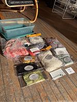 Overhead shot showing all sealed fiber packs arranged in front of plastic bin