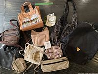 Overview of ten assorted bags and purses showing styles, colors, and materials