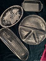 All items grouped on black background showing woodgrain and glass pieces