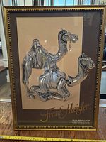 Full frontal view of the framed camel print showing the overall artwork and gilded frame
