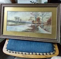Photo of antique watercolour landscape painting in gold mat and carved wood frame with patina