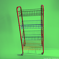 Full view of the colorful metal wire rolling bar cart against green background, showing its three wire shelves colored red, blue, and yellow, with a red frame and small caster wheels.