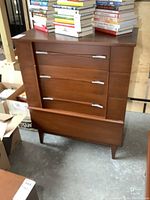 Front view showing four drawers and curved chrome handles