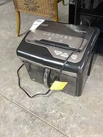 Front and top view of the Staples MailMate paper shredder showing control panel and paper slot.