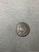 Obverse side of 1867 US 2 cent coin, showing denomination and surrounding text