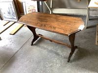 Angle view of the full sofa table illustrating overall shape and size.