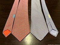 Both ties laid side by side full length