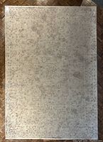 Full top-down view of entire rug on hardwood floor