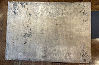 Full top-down view of rectangular rug showing overall abstract pattern and coloration.