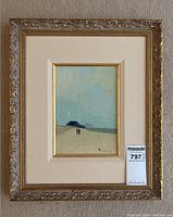 Frontal shot of the oil painting in ornate gold frame with linen mat