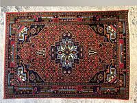 Full front view of entire rug laid flat on light floor