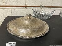 Silver covered serving dish and crystal bowl overview