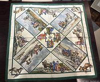 Full flat layout of navy and white scarf showing entire design and green border