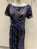 Front view of vintage 100% silk Elie Tahari dress on mannequin, showing geometric pattern and dress silhouette