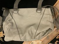 Front view of the vintage grey leather VINCE bag showing leather texture and stitching detail.