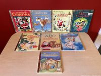Front view showing all 8 vintage A Little Golden Books with Christmas themes arranged upright.