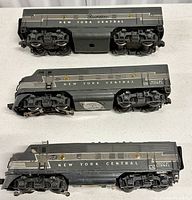 Top view showing undercarriage and wheel detail on the two locomotives and the freight car.
