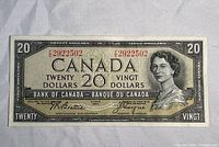 Front side of the 1954 Canadian 20 dollar bill with serial number visible and portrait of Queen Elizabeth II.