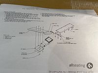 Instruction sheet showing the assembly and installation diagram of the keyboard mechanism under the table, including labeled parts and mounting points.
