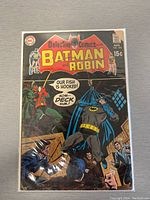 Full front cover of Detective Comics #390 showing Batman and Robin in classic poses with bright cover colors and text about the story.