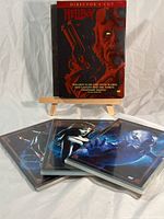 Hellboy Director's Cut DVD front cover showing illustrated character with gun on small wooden easel