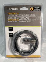 Front packaging of the Targus DEFCON CL cable lock showing product name and coiled cable lock inside clear plastic.