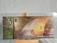 Full display of the Karatbars gold bar within the official certificate holder showing artwork and certification details.