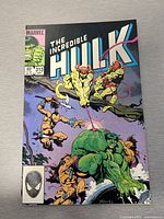 Front cover of The Incredible Hulk comic book issue 313 showing action scene with Hulk and other characters.