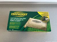 Front and top view of YardWorks Leaf Collection Paper Bags box showing there are three bags in the box, but only two included.