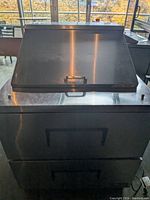 Front view of cooler with closed sloped lid