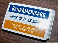 Top card of the deck showing 'BankAmericard Think of it as money' slogan with orange and blue text.