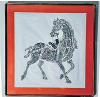 Full view of framed antique Chinese horse rubbing artwork showing the horse in profile with reins, saddle, and detailed legs in black ink on white paper with a red border and gold frame.