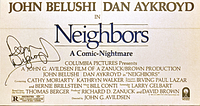 Front close-up showing the "Neighbors" movie title, cast names including John Belushi and Dan Aykroyd, and Dan Aykroyd's signature in black ink.