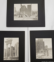 Photo showing all three historical earthquake photographs mounted on black mattes arranged on a flat surface.