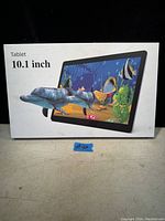 Photo of the tablet box with aquatic 3D fish image and '10.1 inch Tablet' text on front