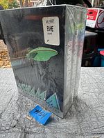 Photo of the shrink-wrapped Futurama complete series DVD set showing the box artwork and original packaging with a Walmart sticker.