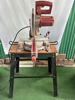 Front view of saw mounted on metal stand