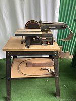 Full view of Craftsman belt and disc sander mounted on stand with power cord and sanding belt included.