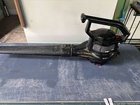 Side view of the Toro Super Blower Vac showing the long nozzle and handle.