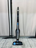 Front view of Electrolux Ergorapido cordless vacuum standing upright showing brand and model graphics on handle and base.