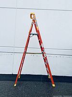 Fully open front view showing orange rails, silver steps, yellow top pad